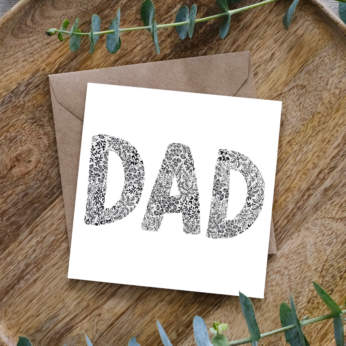 Square dad card with floral-patterned letters on white, kraft envelope on wooden tray, DSCF1486_copy_2.jpg gallery 1