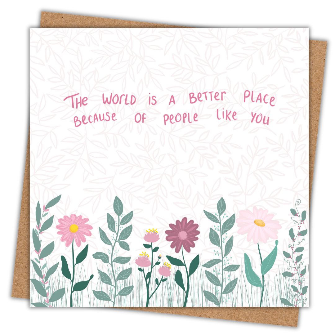 A square greeting card with a kraft envelope behind it. The card has a white background with a faint leaf pattern, pink handwritten-style text reading 'The world is a better place because of people like you,' and a row of illustrated flowers and green leaves along the bottom.