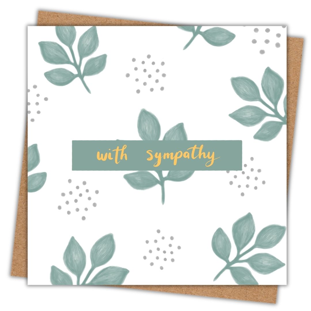 Our sympathy card has the words "with sympathy" written in the centre in a gold hand writing. It's framed by a small sage green rectangle. Behind it the card is made up of a simple cluster of five sage green leaves and little clusters of sage green dots. There is a brown kraft envelope under the card.