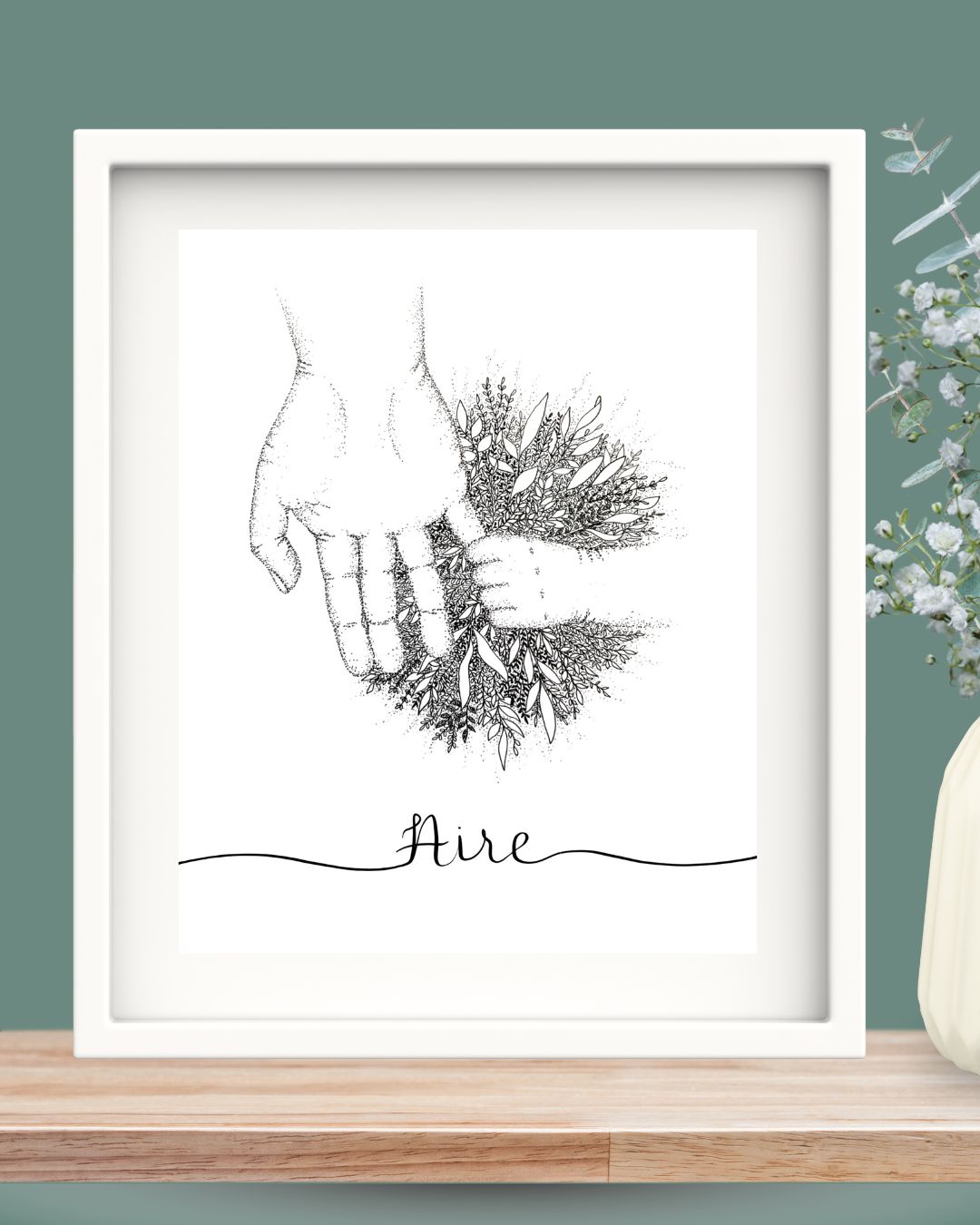 Framed Aire print showing a child and adult hands joined together in a leafy bouquet. The entire design is created from dots and leaves, making this an intricate and detailed piece. Framed in a white solid wood Irish frame.