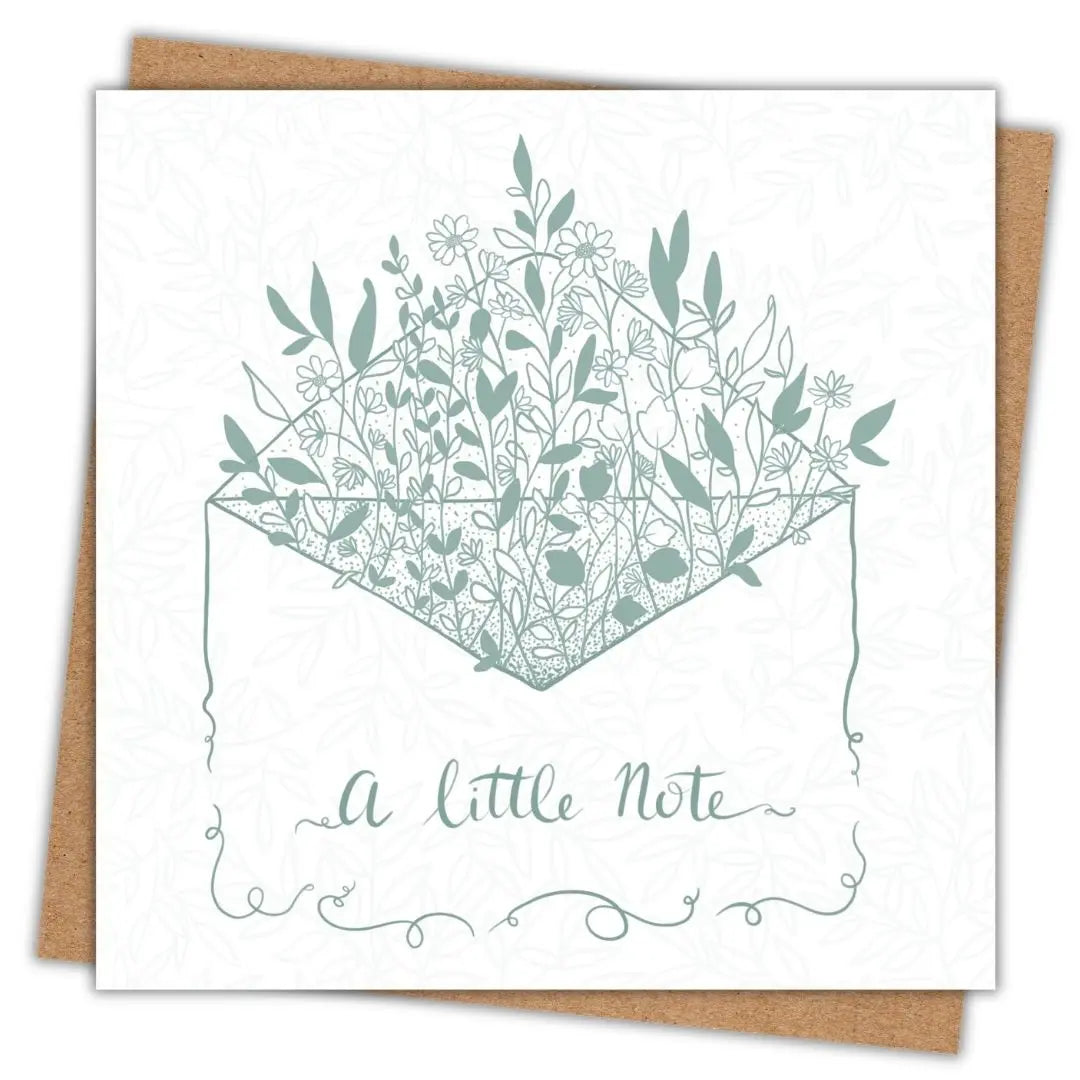 Botanical themed greeting card which is itself a hand drawn illustration of an envelope. Springing up out of the envelope are lots of leaves, petals, and little wildflowers, in sage green and white. On the front of the envelope it says "A Little Note" in handwritten script writing in the sage green.