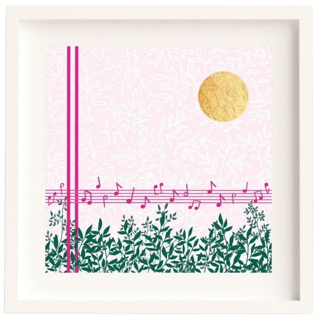 Midday Melody is a square design. The background is a soft light pink with a white leafy pattern. To the fore there are strong pink lines. Two vertical lines, and 5 horizontal lines forming a music stave with a scattering of pink notes on it. Along the bottom there are lots of green branches full of leaves. In the top right corner there is bright circle of gold leaf which has lovely texture to it. The design is framed in a white solid wood Irish made frame.