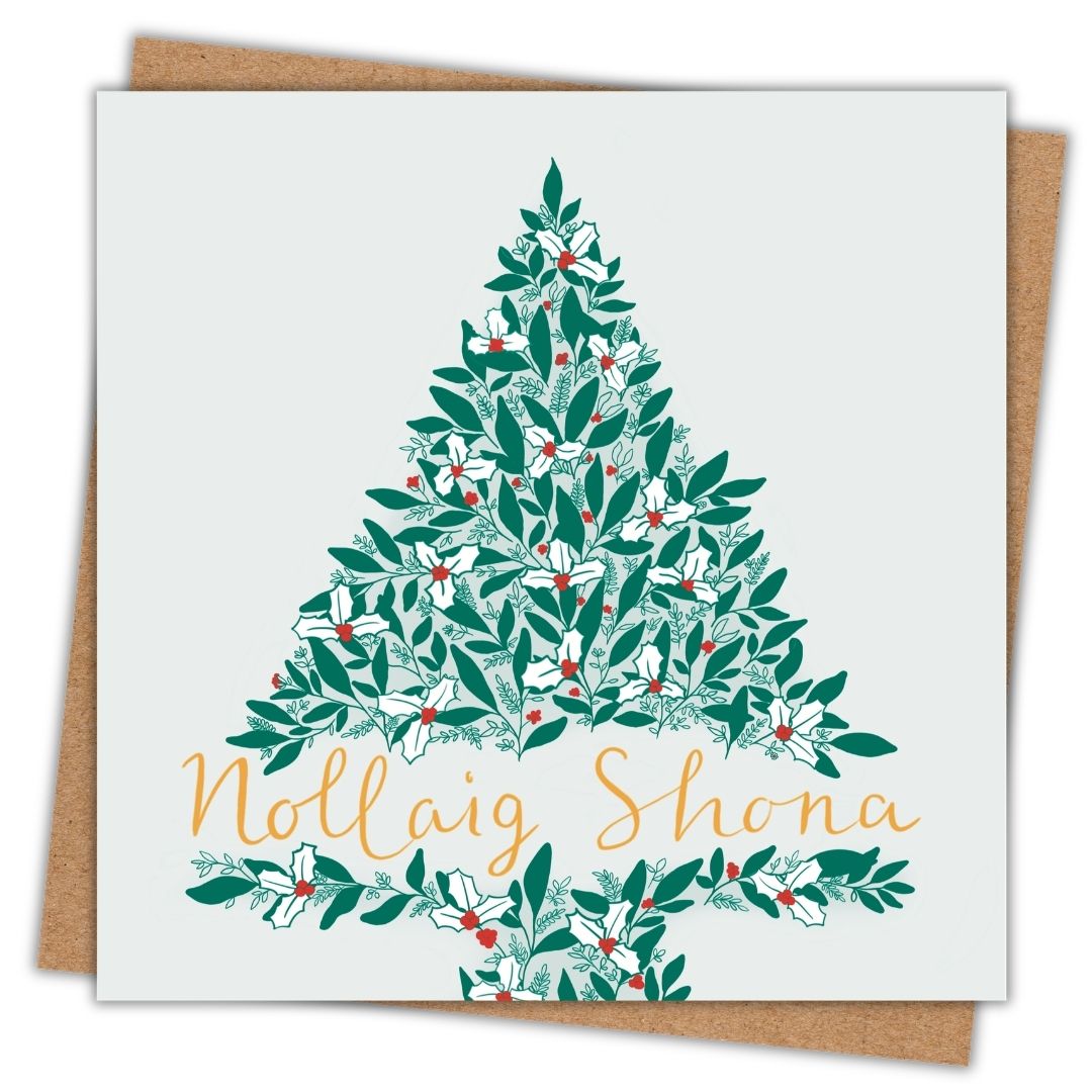 Irish Christmas card with the words Nollaig Shona in gold writing on a green tree made of leaves and holly.