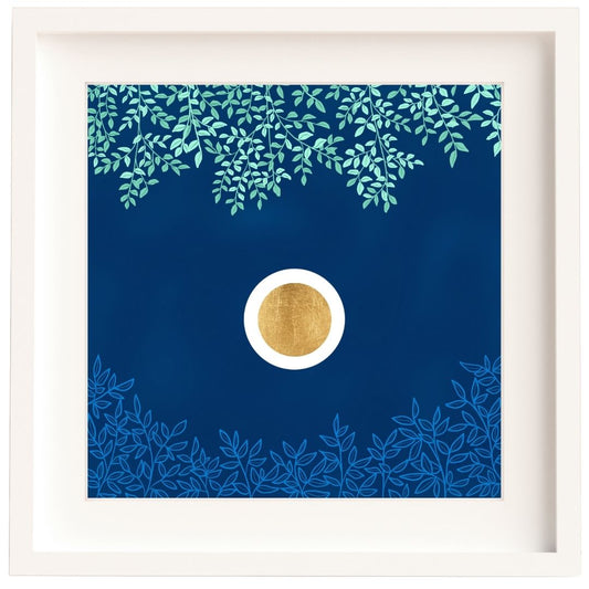 Framed Irish artwork of a gold leaf circle set in a white orb. These are set against a dark blue textured sky. Above there are green branches, and below there are light blue branches. The print is mounted and framed in a solid wood Irish made white frame.