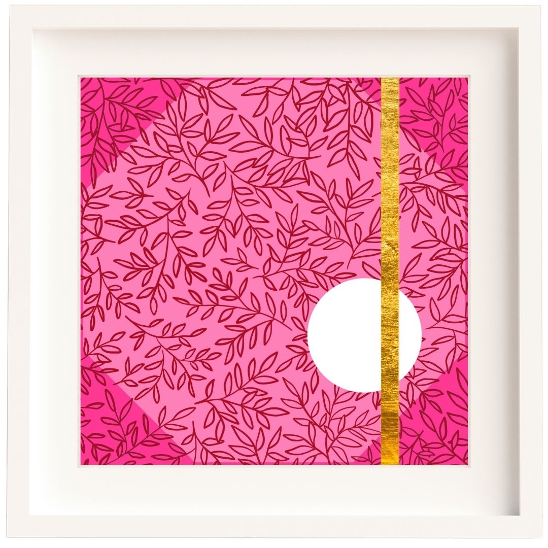 Framed Irish artwork with deep pink leaf pattern on a light pink background, with a darker pink triangle in each corner. There are a few different shades of pink working together here.
There's a clean white circle to the lower right side and one gold stripe made from gold leaf which goes from the top of the print to the bottom, crossing through the white circle. The print is framed in a white solid wood frame, and a white mount.