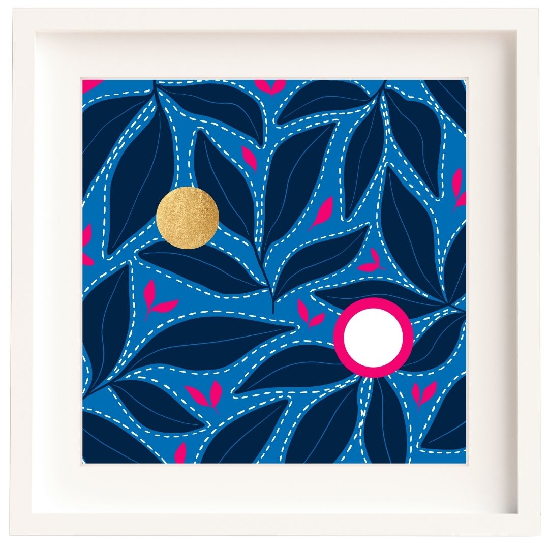 Framed Irish artwork with a pattern of dark blue leaves floating on a light blue surface. There are bright pink accents in leaf shapes as well as two circles. One circle is up to the left, is made from gold leaf so there's a shine to it. The second is down to the right and it white with a bright pink surround. The print is mounted and framed in a solid wood Irish made frame.