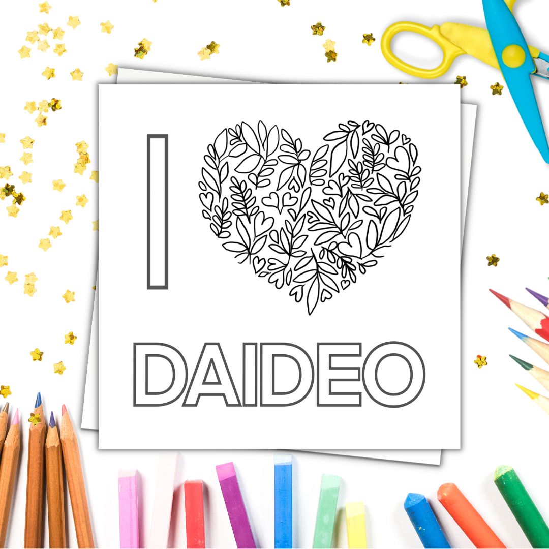 Image shows colour in card with the phrase I LOVE YOU DAIDEO . LOVE is a heart made from floral drawings and tiny hearts. Image laid on a white surface with colourful crayons pencils and gold stars.